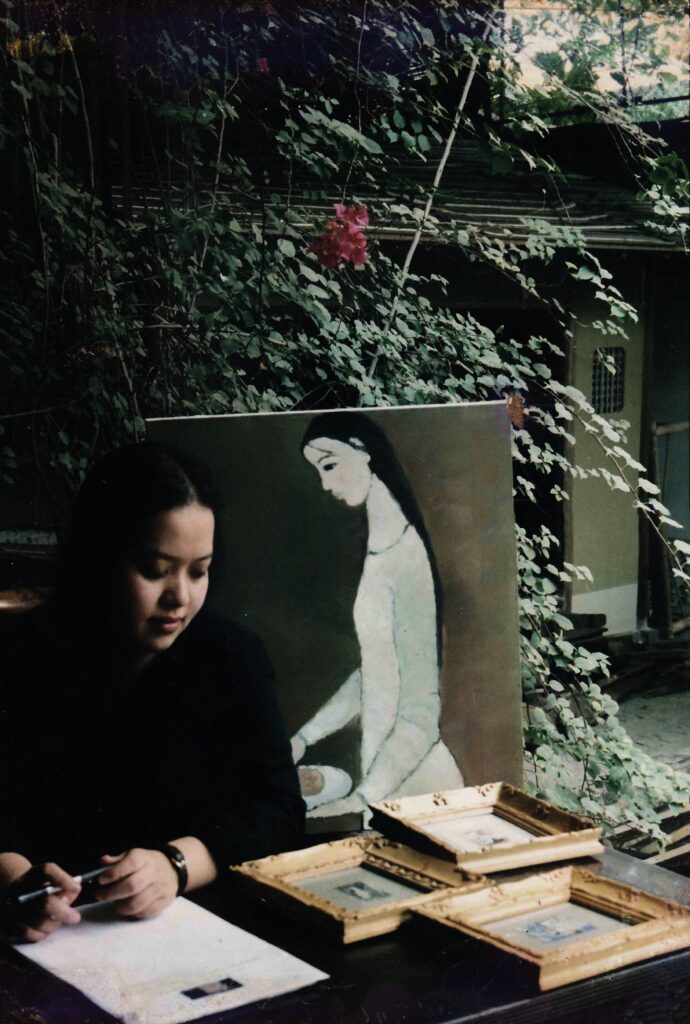 Minh Chau preparing for the exhibition Small and Miniature Paintings by the Masters at her own art gallery, 7 Ly Dao Thanh, Hanoi, Vietnam