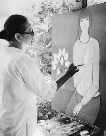 Artist Boi Tran painting in her studio