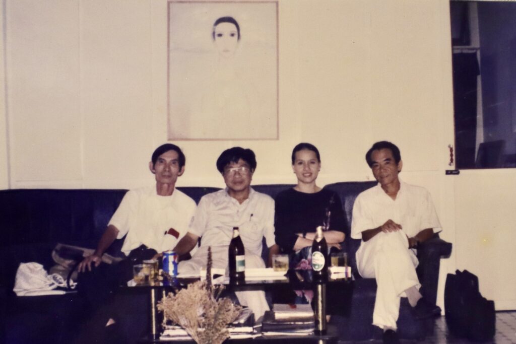 Vinh Phoi, Professor, Painter, Dean, Hue College of Fine Arts (1966-1975), Vice President, Hue University of Fine Arts (1975-1999); Tham Duc Tu, Painter, Former General Secretary and President, Hanoi Fine Arts Association; Boi Tran and Hoang Phu Ngoc Tuong, Author at Boi Tran Art Gallery, Tran Hung Dao Street, Hue, Vietnam, circa 1995.