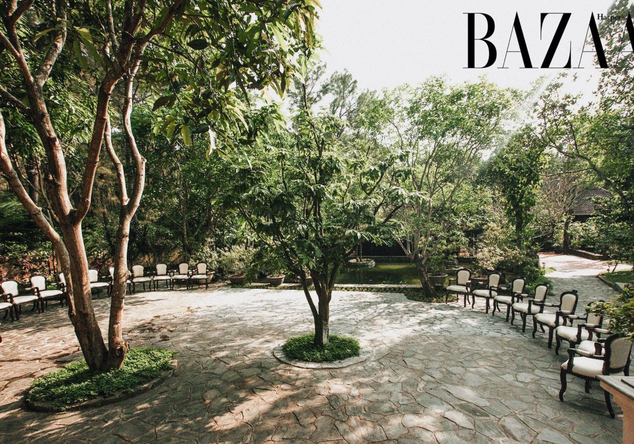 The garden paths are lined with lush greenery and flowers.